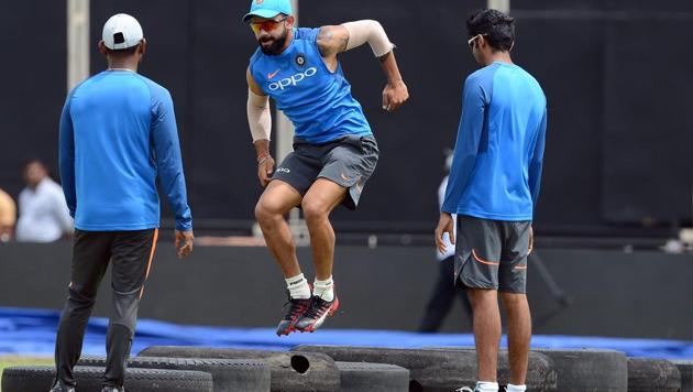 Virat Kohli (C), Indian cricket team captain, warms up during a practice session at the Rangiri Dambulla International Cricket Stadium, ahead of the ODI series against Sri Lanka. (AFP) Virat Kohli (C), Indian cricket team captain, warms up during a practice session at the Rangiri Dambulla International Cricket Stadium, ahead of the ODI series against Sri Lanka. (AFP)