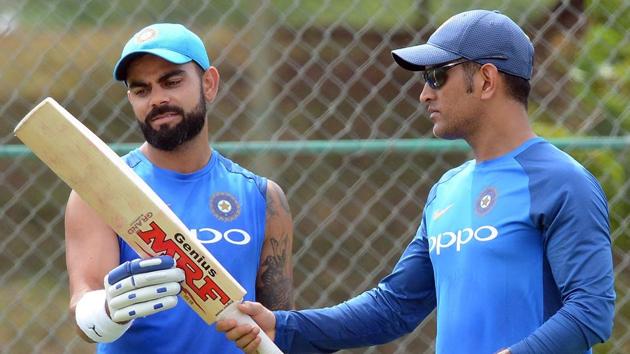 Indian cricket captain Virat Kohli (L) speaks with his teammate Mahendra Singh Dhoni during a practice session at the Rangiri Dambulla International Cricket Stadium in Dambulla. (AFP) Indian cricket captain Virat Kohli (L) speaks with his teammate Mahendra Singh Dhoni during a practice session at the Rangiri Dambulla International Cricket Stadium in Dambulla. (AFP)