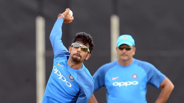 Jasprit Bumrah practices while Ravi Shastri has a keen look at proceedings. (AFP) Jasprit Bumrah practices while Ravi Shastri has a keen look at proceedings. (AFP)