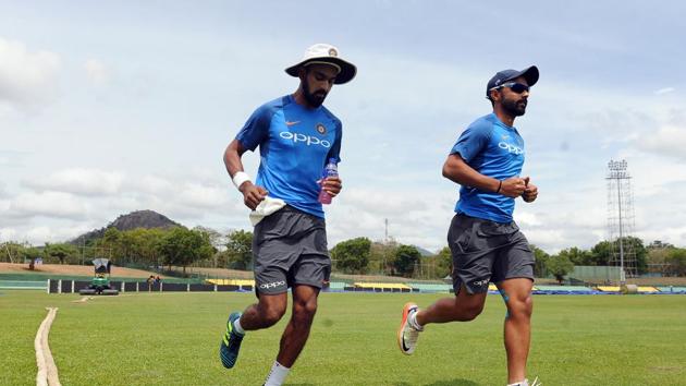 Ajinkya Rahane (R) and KL Rahul warm up during a practice session at the Rangiri Dambulla International Cricket Stadium in Dambulla. (AFP) Ajinkya Rahane (R) and KL Rahul warm up during a practice session at the Rangiri Dambulla International Cricket Stadium in Dambulla. (AFP)