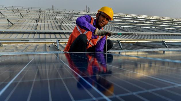 In a report released by Bridge to India(BTI), India is expected to add 9.4 gigawatts (GW) to its solar power capacity in 2017. However rising competition has brought tariffs down as the sector faces headwinds from module price rises, tender cancellations and GST. Despite this, as per BTI’s India Solar Compass predicts higher forecasts than earlier this year and expects this trend to continue through 2017. (AFP) In a report released by Bridge to India(BTI), India is expected to add 9.4 gigawatts (GW) to its solar power capacity in 2017. However rising competition has brought tariffs down as the sector faces headwinds from module price rises, tender cancellations and GST. Despite this, as per BTI’s India Solar Compass predicts higher forecasts than earlier this year and expects this trend to continue through 2017. (AFP)