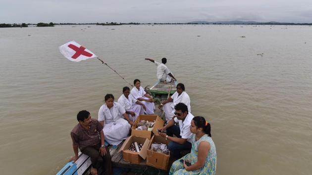 Medical officials of the Jhargaon Public Health Centre travel in a boat to a medical camp in flood-affected Morigaon district in India's northeastern Assam state on August 18, 2017. At least 221 people have died and more than 1.5 million have been displaced by monsoon floods across India, Nepal and Bangladesh, officials have said. (AFP) Medical officials of the Jhargaon Public Health Centre travel in a boat to a medical camp in flood-affected Morigaon district in India's northeastern Assam state on August 18, 2017. At least 221 people have died and more than 1.5 million have been displaced by monsoon floods across India, Nepal and Bangladesh, officials have said. (AFP)