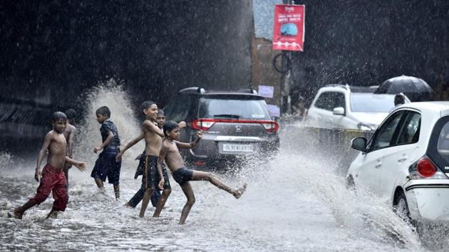 Children play in a flooded street near Vinod nagar in East Delhi on August 7, 2017.(Arun Sharma/HT Photo) Children play in a flooded street near Vinod nagar in East Delhi on August 7, 2017.(Arun Sharma/HT Photo)