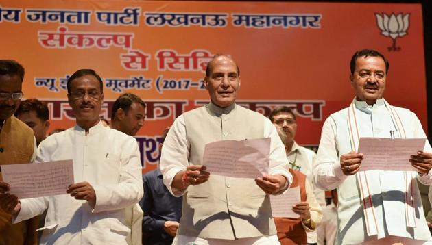 Union home minister Rajnath Singh with Uttar Pradesh deputy chief ministers Keshav Prasad Maurya (right) and Dinesh Sharma (left) administering the Sankalp oath in Lucknow on Friday. (PTI) Union home minister Rajnath Singh with Uttar Pradesh deputy chief ministers Keshav Prasad Maurya (right) and Dinesh Sharma (left) administering the Sankalp oath in Lucknow on Friday. (PTI)