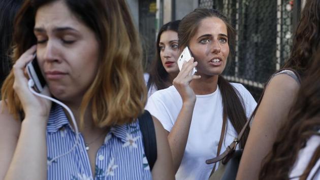 Hours after the attack, authorities reported two arrests - one a Spanish national from Melilla, a Spanish-run Mediterranean seafront enclave in North Africa and the other a Moroccan. Catalan police said a driver ran over two police officers at a checkpoint in Barcelona after the van attack, but it was not clear if the incidents were linked. (Pau Barrena/AFP)