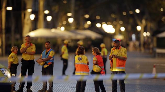 Emergency workers stand on a blocked street in Barcelona, Spain, Thursday, Aug. 17, 2017. (AP) Emergency workers stand on a blocked street in Barcelona, Spain, Thursday, Aug. 17, 2017. (AP)