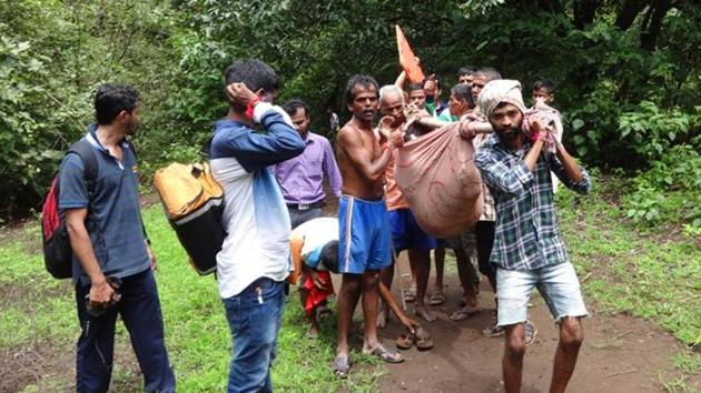 One of the victims of a trekking accident being taken to hospital after the Shivdurga Mitra Rescue mission. (HT PHOTO) One of the victims of a trekking accident being taken to hospital after the Shivdurga Mitra Rescue mission. (HT PHOTO)
