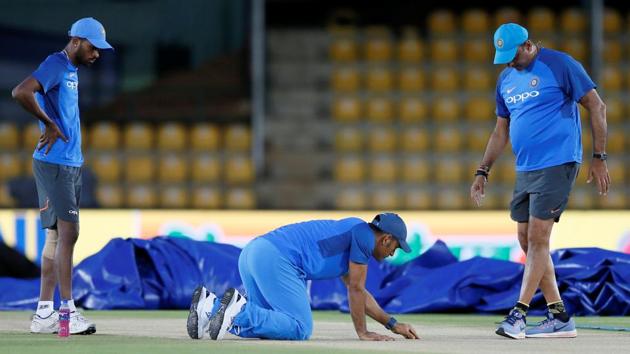 Former captain MS Dhoni, all-rounder Hardik Pandya and coach Ravi Shastri inspect the pitch ahead of their first ODI. (REUTERS) Former captain MS Dhoni, all-rounder Hardik Pandya and coach Ravi Shastri inspect the pitch ahead of their first ODI. (REUTERS)
