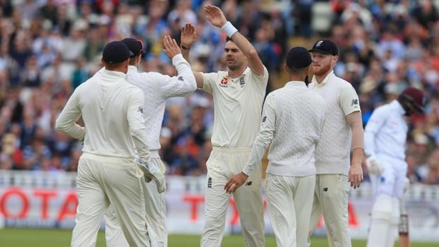 England bowler James Anderson (C) celebrates with teammates after taking the wicket of West Indies' Roston Chase on Day 3 of the first Test at Edgbaston in Birmingham on Saturday. (AFP) England bowler James Anderson (C) celebrates with teammates after taking the wicket of West Indies' Roston Chase on Day 3 of the first Test at Edgbaston in Birmingham on Saturday. (AFP)