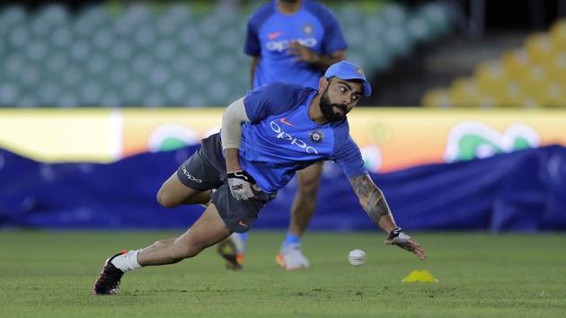 Indian cricket captain Virat Kohli fields a ball during a practice session ahead of their first One-Day International against Sri Lanka in Dambulla. (AP) Indian cricket captain Virat Kohli fields a ball during a practice session ahead of their first One-Day International against Sri Lanka in Dambulla. (AP)