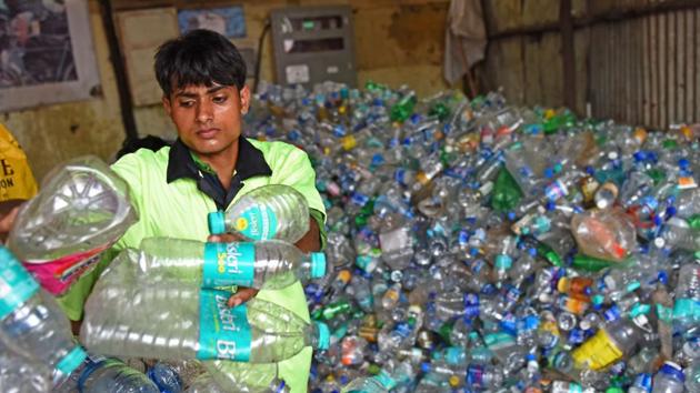 A man sort bottles at the Bandra centre in Mumbai on Friday. (Satyabrata Tripathy/HT Photo) A man sort bottles at the Bandra centre in Mumbai on Friday. (Satyabrata Tripathy/HT Photo)