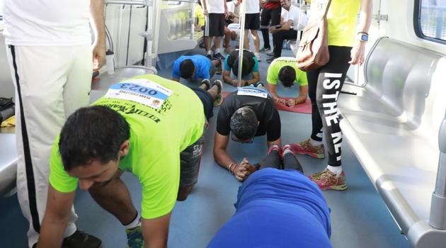 Fitness enthusiasts take the plank challenge on a moving metro in Gurgaon. Fitness enthusiasts take the plank challenge on a moving metro in Gurgaon.