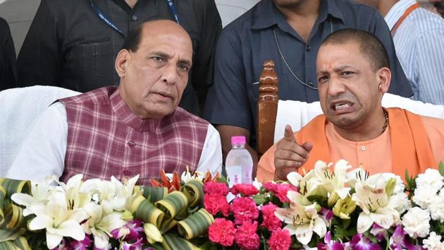 Union Home Minister Rajnath Singh with Uttar Pradesh Chief Minister Yogi Adityanath during a function to distribute loan waiver certificates to farmers under 'Fasli Rin Mochan Yojna' in Lucknow on Thursday. (PTI)