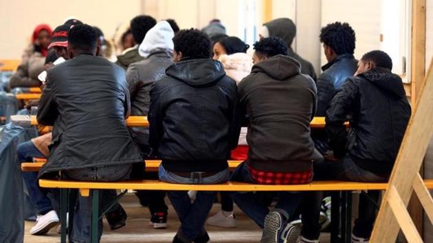 Eritrean migrants receive food after arriving by plane from Italy at the first registration camp in Erding near Munich, Germany, November 15, 2016. (Reuters File Photo) Eritrean migrants receive food after arriving by plane from Italy at the first registration camp in Erding near Munich, Germany, November 15, 2016. (Reuters File Photo)