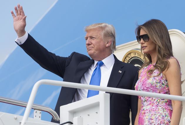 This file photo taken on July 25, 2017 shows US President Donald Trump and First Lady Melania Trump boarding Air Force One at Andrews Air Force Base in Maryland. (AFP) This file photo taken on July 25, 2017 shows US President Donald Trump and First Lady Melania Trump boarding Air Force One at Andrews Air Force Base in Maryland. (AFP)
