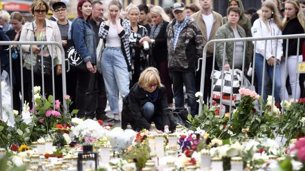 Candles and flowers are left at the makeshift memorial by well wishers for the victims of Friday's stabbings at the Turku Market Square, Finland on August 19, 2017. (AFP) Candles and flowers are left at the makeshift memorial by well wishers for the victims of Friday's stabbings at the Turku Market Square, Finland on August 19, 2017. (AFP)