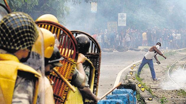 A supporter of a separate Gorkhaland state throws a projectile at police during an indefinite strike at Sukna village in Darjeeling district on the outskirts of Siliguri on July 29. (AFP FILE) A supporter of a separate Gorkhaland state throws a projectile at police during an indefinite strike at Sukna village in Darjeeling district on the outskirts of Siliguri on July 29. (AFP FILE)
