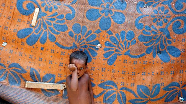 A boy from the Rohingya community stands outside a shack in a camp in Delhi. (Cathal McNaughton /REUTERS)