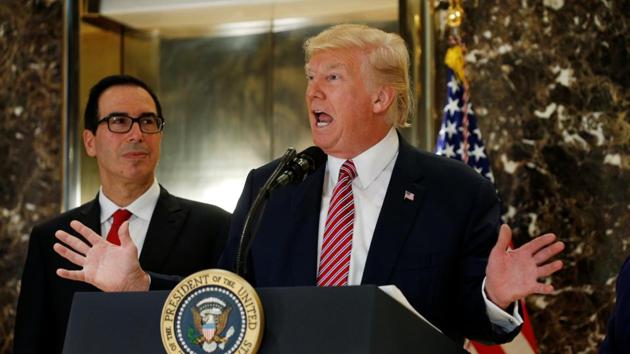 US President Donald Trump answers questions about his responses to the deaths and injuries at the "Unite the Right" rally in Charlottesville as he talks to the media with Treasury Secretary Steven Mnuchin (L) at his side in the lobby of Trump Tower in Manhattan, New York, August 15, 2017. (REUTERS) US President Donald Trump answers questions about his responses to the deaths and injuries at the "Unite the Right" rally in Charlottesville as he talks to the media with Treasury Secretary Steven Mnuchin (L) at his side in the lobby of Trump Tower in Manhattan, New York, August 15, 2017. (REUTERS)