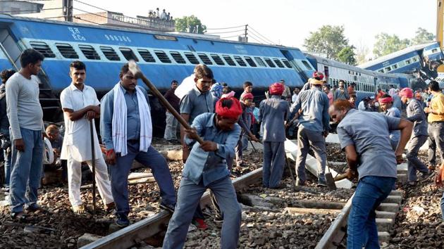 Workers repair the rail track on Sunday after the Kalinga Utkal Express derailed in Khatauli near Muzaffarnagar on Saturday evening.(PTI Photo) Workers repair the rail track on Sunday after the Kalinga Utkal Express derailed in Khatauli near Muzaffarnagar on Saturday evening.(PTI Photo)