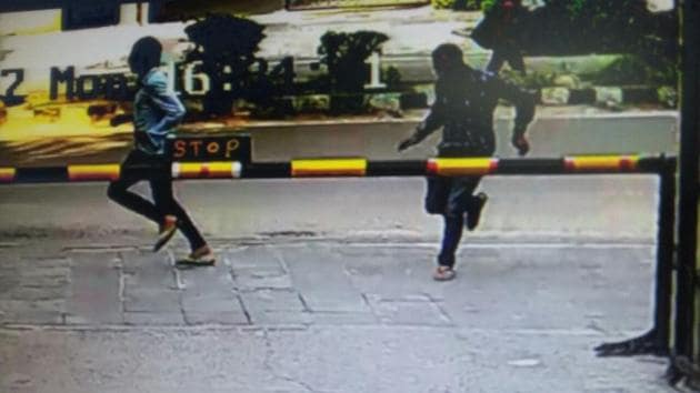 A grab from CCTV footage shows fleeing carjackers who entered True Friends Apartment in Dwaka Sector 6. One of the criminals was caught while the other escaped. (Sourced) A grab from CCTV footage shows fleeing carjackers who entered True Friends Apartment in Dwaka Sector 6. One of the criminals was caught while the other escaped. (Sourced)
