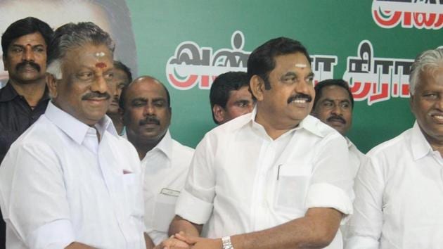 Panneerselvam and Palaniswami shake hands at the party headquarters after announcing merge of the AIADMK factions.(HT Photo) Panneerselvam and Palaniswami shake hands at the party headquarters after announcing merge of the AIADMK factions.(HT Photo)