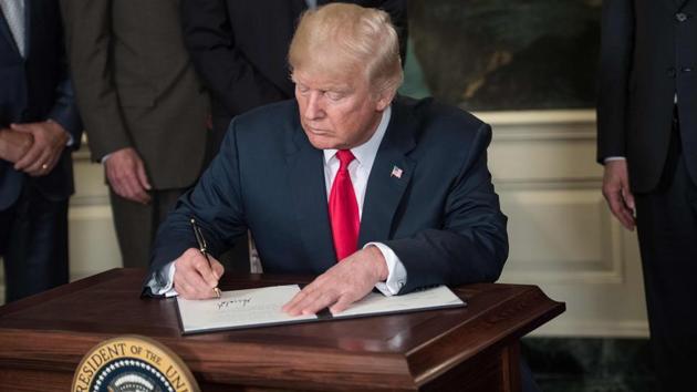 US President Donald Trump signs a memorandum on addressing China’s laws, policies, practices, and actions related to intellectual property, innovation, and technology at the White House in Washington, DC, on August 14. (AFP File Photo) US President Donald Trump signs a memorandum on addressing China’s laws, policies, practices, and actions related to intellectual property, innovation, and technology at the White House in Washington, DC, on August 14. (AFP File Photo)