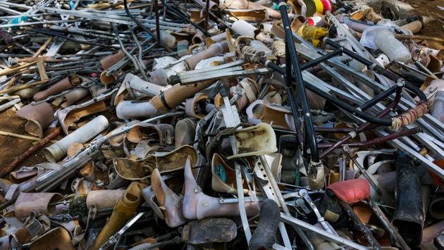 Old prosthetic legs, feet and crutches are seen in a discarded pile at the Bhagwan Mahaveer Viklang Sahayata Samiti’s main branch in Jaipur, Rajasthan. The 2011 census of India places the number of movement impaired people at over 6.1 million. Not all among these have access to mobility aids with the sight of impaired people at traffic stops, wheeling or dragging themselves common. (Chandan Khanna / AFP)