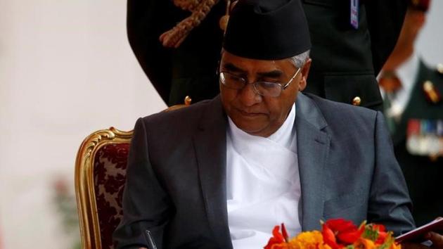 File photo of Nepalese Prime Minister Sher Bahadur Deuba signing the oath after being sworn-in at the presidential building in Kathmandu on June 7, 2017. (Reuters) File photo of Nepalese Prime Minister Sher Bahadur Deuba signing the oath after being sworn-in at the presidential building in Kathmandu on June 7, 2017. (Reuters)