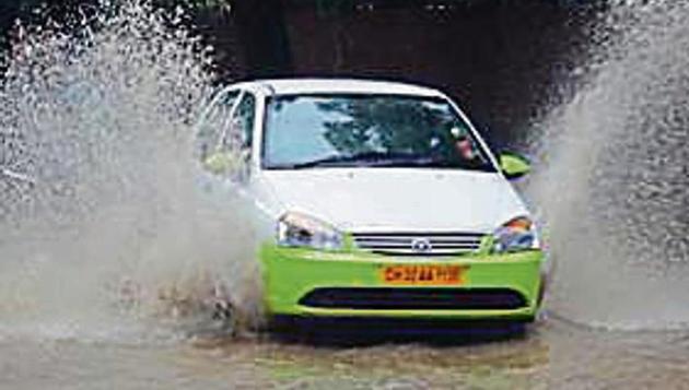 As roads got waterlogged in the tricity, app-based cab services increased their fares during rain on Monday. (HT Photo) As roads got waterlogged in the tricity, app-based cab services increased their fares during rain on Monday. (HT Photo)