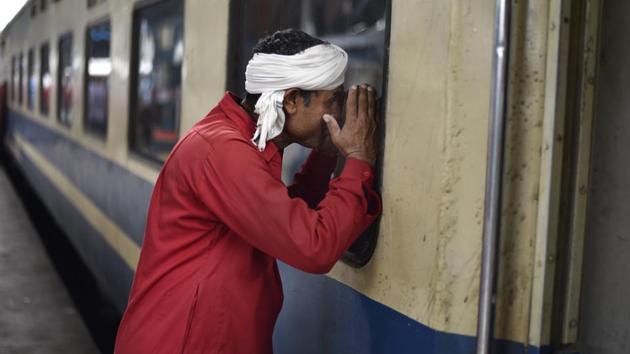 Another aspect of long haul railway commutes in India had been bundles of bedding hauled in by trundling commuters. The coolie would step in, easing the load of passengers, eking an assured sum. The provision of bedding by the Indian Railways put a halt to even this assured avenue of earning money. (Burhaan Kinu / HT Photo)