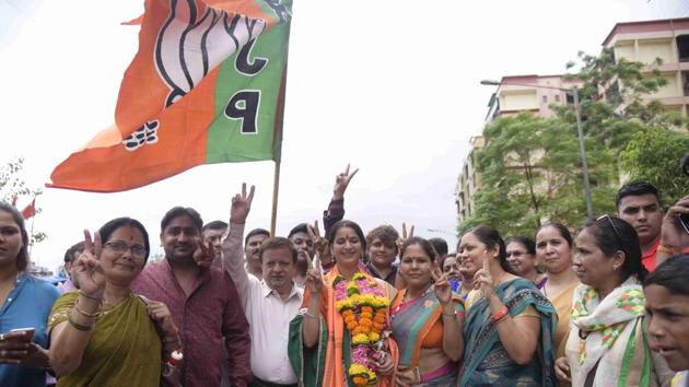 BJP workers celebrate after the results. (HT) BJP workers celebrate after the results. (HT)