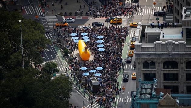 People watch the solar eclipse from Madison Square in midtown Manhattan in New York City. (Brendan McDermid/REUTERS)