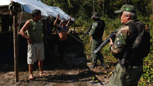 Agent Jaime Pereira da Costa, who is coordinating the effort to stem the destruction said that Apui is witnessing the same pattern of deforestation that has been witnessed elsewhere in the Amazon for decades. Loggers are looking for new land to exploit as they try to dodge the government’s armed environmental protection agents carrying out ‘Operation Green Wave’, the latest effort to tamp down spikes in ruination of the rainforest. (Bruno Kelly/REUTERS)
