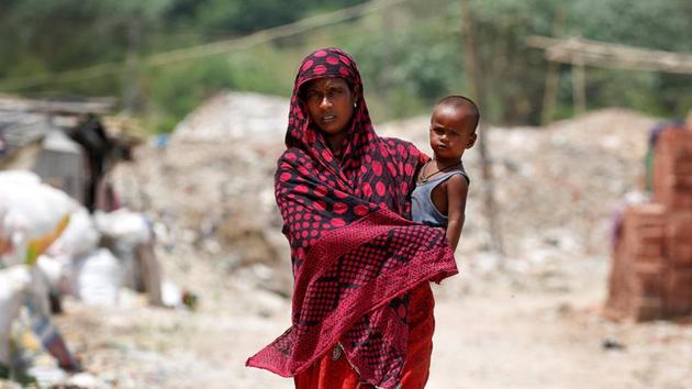 A woman from the Rohingya community walks through a camp in Delhi, India August 17, 2017. (REUTERS Representative Photo) A woman from the Rohingya community walks through a camp in Delhi, India August 17, 2017. (REUTERS Representative Photo)
