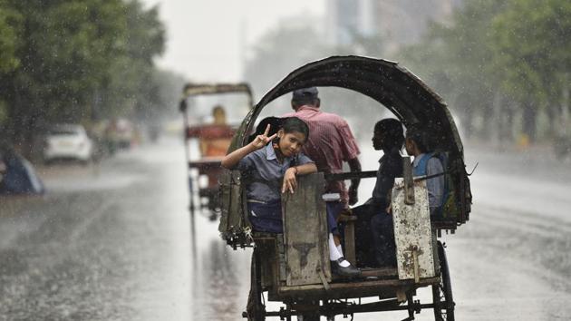 As the showers started after school hours, school students were seen making merry in the rain. (Virendra Singh Gosain/HT PHOTO) As the showers started after school hours, school students were seen making merry in the rain. (Virendra Singh Gosain/HT PHOTO)