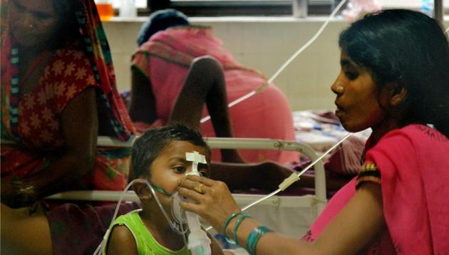 Children receive treatment in the Encephalitis Ward at the Baba Raghav Das Medical College Hospital where over 60 children have died over the past one week, in Gorakhpur district on August 14, 2017. (PTI) Children receive treatment in the Encephalitis Ward at the Baba Raghav Das Medical College Hospital where over 60 children have died over the past one week, in Gorakhpur district on August 14, 2017. (PTI)