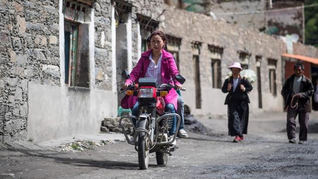 In contrast to the past, today no one in the small community lives more than a half hour’s motorbike trip away.Trysts are arranged ahead of time on the popular cellphone messaging app WeChat and the coy game of token grabbing has mostly disappeared. (Johannes Eisele/AFP)