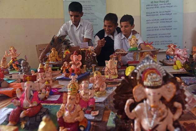 Students of New English School display idols made by them for sale at the campus in Pune. (Pratham Gokhale/ HT Photo) (Pratham Gokhale/HT PHOTO)