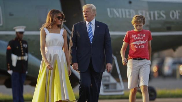 FILE - In this Aug. 20, 2017 file photo, President Donald Trump, first lady Melania Trump and son Barron Trump walk across the tarmac before boarding Air Force One at Morristown Municipal Airport in Morristown, N.J., for the return flight to the Washington. (AP) FILE - In this Aug. 20, 2017 file photo, President Donald Trump, first lady Melania Trump and son Barron Trump walk across the tarmac before boarding Air Force One at Morristown Municipal Airport in Morristown, N.J., for the return flight to the Washington. (AP)