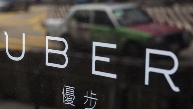 A taxi is reflected in a window at the office of taxi-hailing service Uber Inc in Hong Kong, China August 12, 2015. (Reuters File Photo) A taxi is reflected in a window at the office of taxi-hailing service Uber Inc in Hong Kong, China August 12, 2015. (Reuters File Photo)
