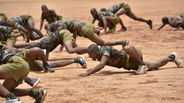 Parachute regiment recruits perform a crocodile walk during a training session. Members of the regiment are selected on the basis of performance efficiency, physical and mental agility as well as preference towards youth. Only those among the armed forces with less than five years of service, ‘Shape-I’ medical fitness and ‘Excellent’ Battle Physical Efficiency Tests results are considered eligible to volunteer for the regiment. (Arijit Sen / HT Photo)