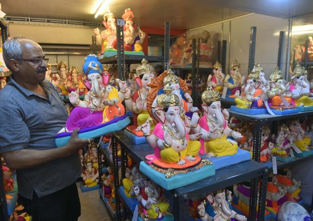 Surendra Bhat showcases the ecofriendly Ganesh Idols at his shop in Narayan Peth in Pune. (Pratham Gokhale/ Hindustan Times) (Pratham Gokhale/HT PHOTO)
