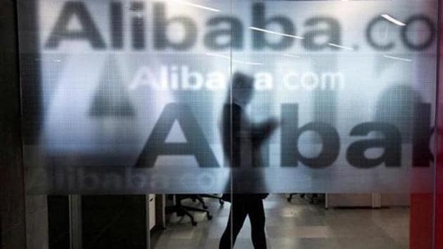 An employee is seen behind a glass wall with the logo of Alibaba at the company's headquarters on the outskirts of Hangzhou, Zhejiang province in China.(Reuters) An employee is seen behind a glass wall with the logo of Alibaba at the company's headquarters on the outskirts of Hangzhou, Zhejiang province in China.(Reuters)