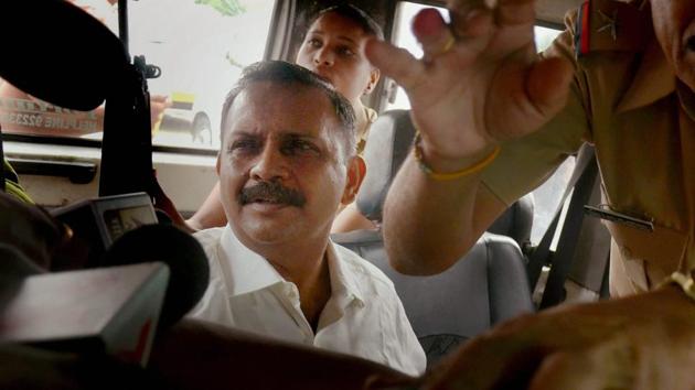 Lt Col Shrikant Prasad Purohit, who was granted bail by the Supreme Court on Monday in the 2008 Malegaon blast case, being taken to the sessions court from Taloja Jail in Navi Mumbai on Tuesday.(PTI Photo)