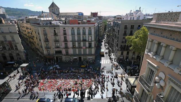 Aerial view taken of flowers and candles displayed to pay tribute to the victims of the Barcelona and Cambrils attacks on the Rambla boulevard in Barcelona on August 22, 2017, five days after the attacks that killed 15 people. (AFP Photo) Aerial view taken of flowers and candles displayed to pay tribute to the victims of the Barcelona and Cambrils attacks on the Rambla boulevard in Barcelona on August 22, 2017, five days after the attacks that killed 15 people. (AFP Photo)