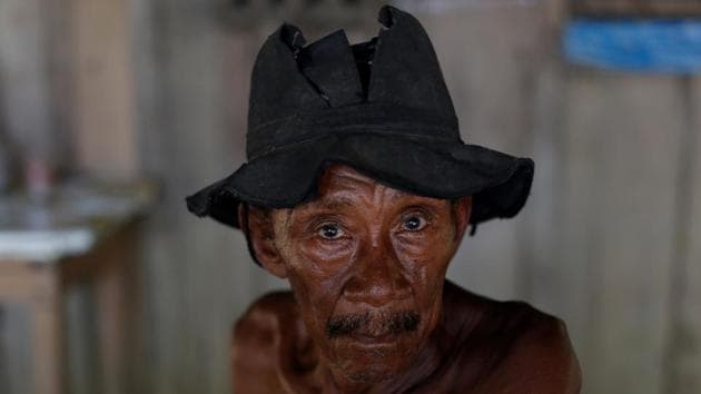 A man poses for a photograph at an illegal gold mine in Apui, Brazil. Trusting that every effort will help to save rainforest, environment minister José Sarney Filho is looking to the next full PRODES data report, due in November to reflect a decline in deforestation. (Bruno Kelly/REUTERS)