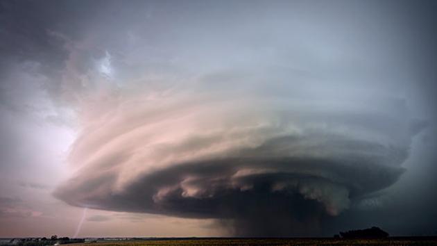 A massive storm hovers over a tiny, near-invisible town, in this still from the trailer. A massive storm hovers over a tiny, near-invisible town, in this still from the trailer.