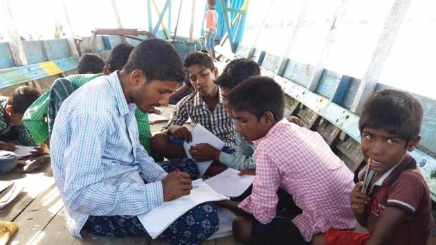Students attend classes on a boat in a ‘floating school’ in Assam. (Utpal Parashar/HT Photo) Students attend classes on a boat in a ‘floating school’ in Assam. (Utpal Parashar/HT Photo)