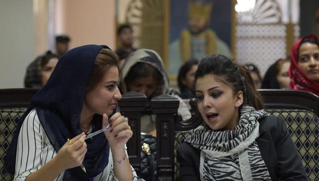 In this photograph taken on August 16, 2017, Tahmina Arian (L), 26, talks with Tahmina Rashiq at the first public event for the "Where Is My Name" campaign in Kabul. A social media campaign demanding that Afghan men refer to their wives by their own names in public -- rather than "wife of" or "daughter of" -- is gaining traction in the deeply patriarchal country. (AFP) In this photograph taken on August 16, 2017, Tahmina Arian (L), 26, talks with Tahmina Rashiq at the first public event for the "Where Is My Name" campaign in Kabul. A social media campaign demanding that Afghan men refer to their wives by their own names in public -- rather than "wife of" or "daughter of" -- is gaining traction in the deeply patriarchal country. (AFP)